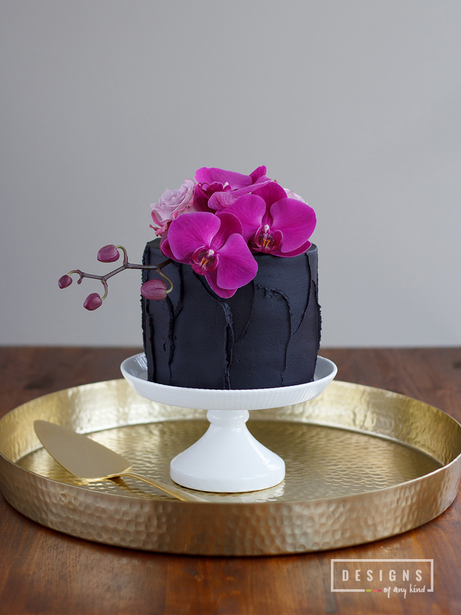 Chocolate Lavender Truffle Cake. Dense chocolate cake layered with rich chocolate truffle ganache and a note of delicate lavender. The perfect Valentine's Day treat for you and that special someone. Recipe at www.designsofanykind.com