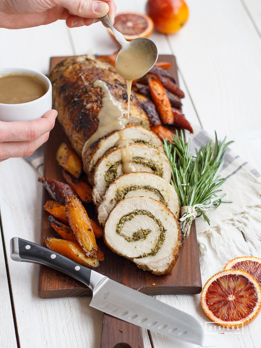 Rosemary Pesto Stuffed Pork Loin with Blood Orange Carrots. This mouthwatering pork loin is stuffed with fresh rosemary pesto and served alongside roasted blood orange carrots. Perfect for the Easter holiday or a springtime dinner. Recipe at www.designsofanykind.com