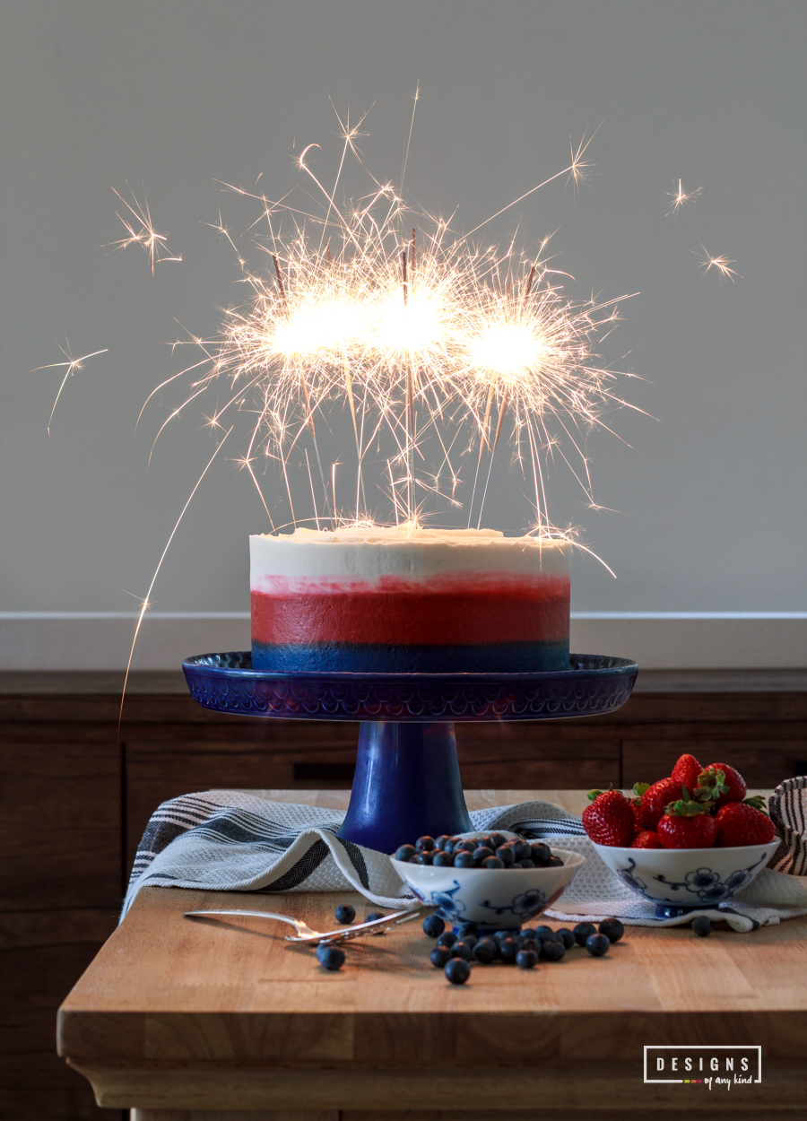 A Very Patriotic Fourth of July Ombre Cake. Break out the sparklers! This patriotic Fourth of July Ombre Cake, with it's red, white and blue color, is sure to be quite the show. A delicate white cake with a hint of lemon and almond is layered with strawberry and blueberry jam. So good and so very patriotic! Find this recipe at www.designsofanykind.com