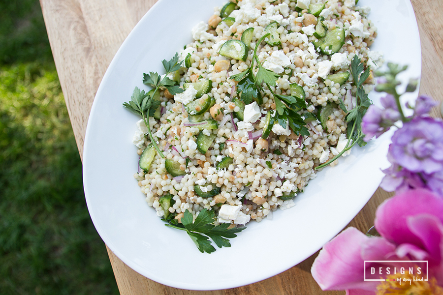 Israeli Couscous Salad with Feta and Cucumbers. A fresh, delicious salad bursting with lemony-garlic flavors, salty feta cheese, and juicy cucumbers. Recipe at www.designsofanykind.com