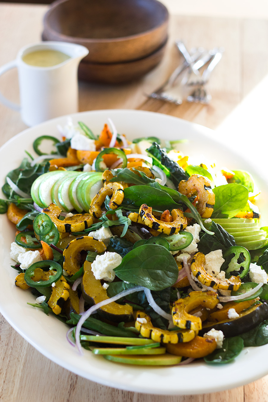 Grab the recipe for the Roasted Winter Squash Salad loaded with roasted squash, crisp apples, field greens, feta cheese and a sage-honey vinaigrette! Recipe at www.designsofanykind.com