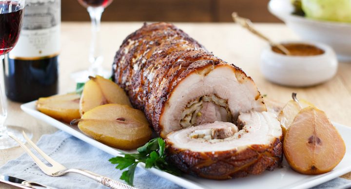 Make this tender, slow roasted pork belly marinated in bourbon mustard and stuffed with tangy pears. A stunning dish for your next dinner party. Recipe at www.designsofanykind.com.