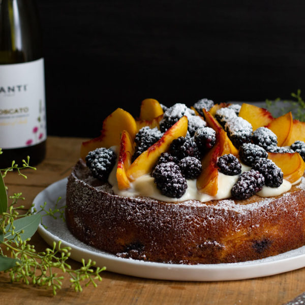Sparkling Moscato wine meets fresh peaches and blackberries in this dense, rich Blackberry Peach Moscato Cake. A sweet, summery dream come true! Recipe at www.designsofanykind.com